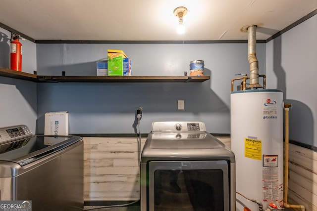 laundry room with washer and clothes dryer and gas water heater