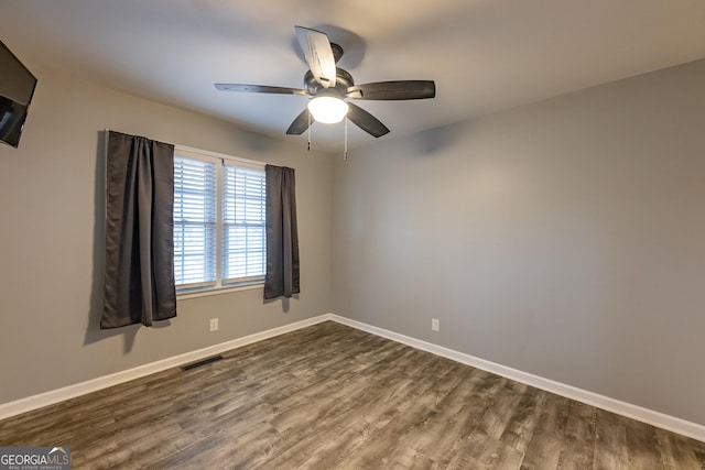 spare room featuring ceiling fan and wood-type flooring