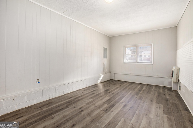 1471 Cedar Creek Ln, Riverdale, GA 30296 - unfurnished room featuring electric panel, wood finished floors, and crown molding