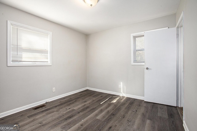 1471 Cedar Creek Ln, Riverdale, GA 30296 - unfurnished room with dark wood-style flooring and baseboards