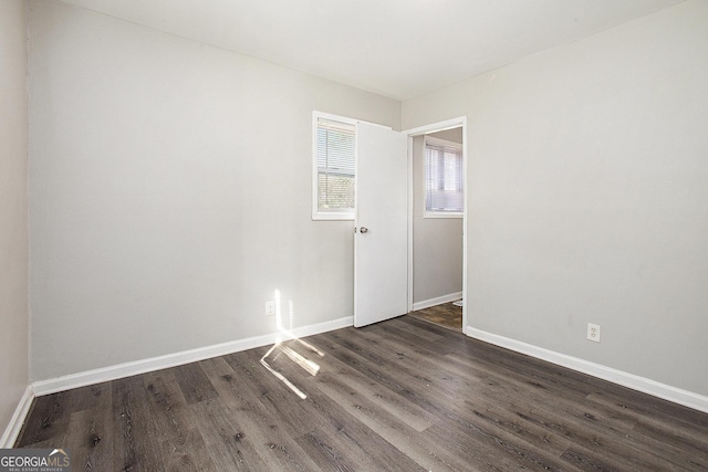 1471 Cedar Creek Ln, Riverdale, GA 30296 - unfurnished room with dark wood-style flooring