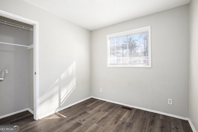 1471 Cedar Creek Ln, Riverdale, GA 30296 - unfurnished bedroom featuring dark wood finished floors