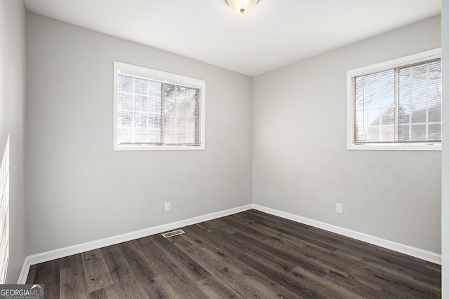 1471 Cedar Creek Ln, Riverdale, GA 30296 - spare room with plenty of natural light and dark wood finished floors