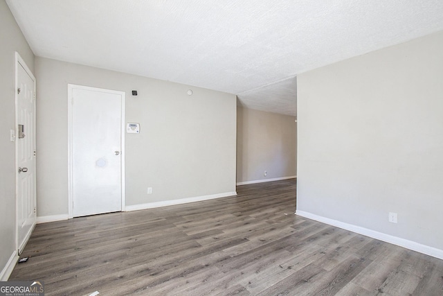 1471 Cedar Creek Ln, Riverdale, GA 30296 - empty room with wood finished floors and baseboards