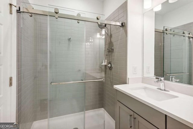 bathroom with vanity and an enclosed shower