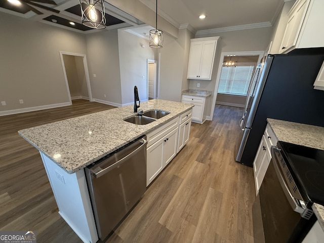 kitchen featuring a sink, white cabinets, hanging light fixtures, dishwasher, and a center island with sink