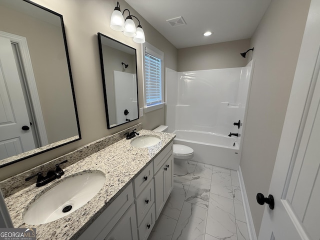 bathroom featuring visible vents, marble finish floor, a sink, and toilet