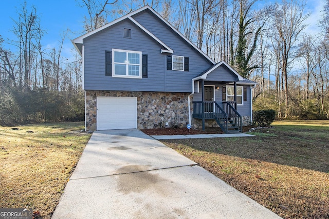 view of front facade with a garage and a front lawn