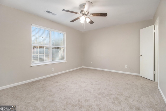 carpeted empty room with ceiling fan