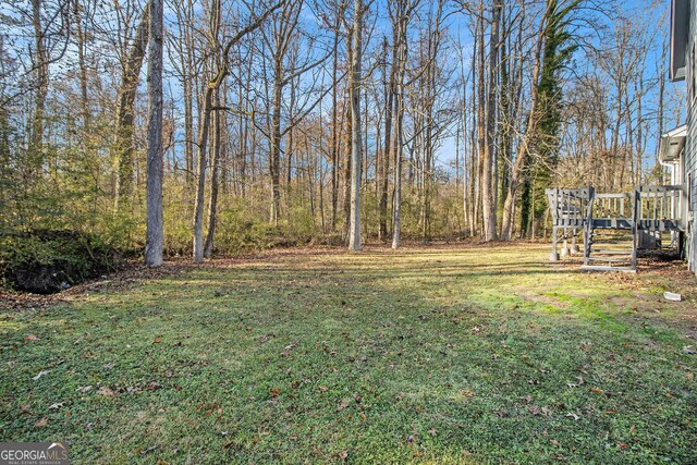 view of yard with a deck