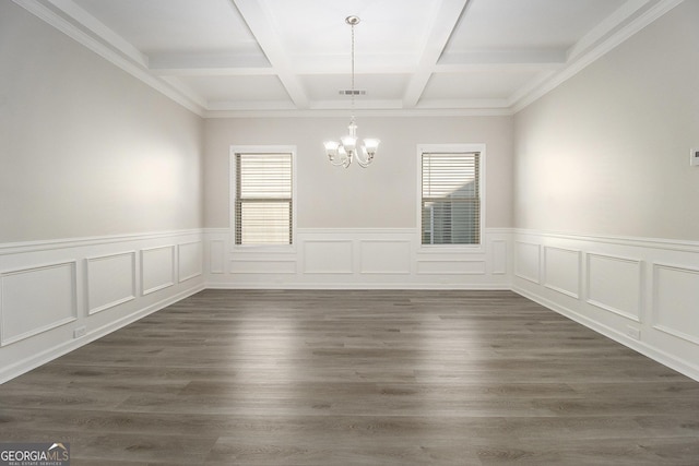 empty room featuring coffered ceiling, beam ceiling, dark hardwood / wood-style flooring, and a chandelier