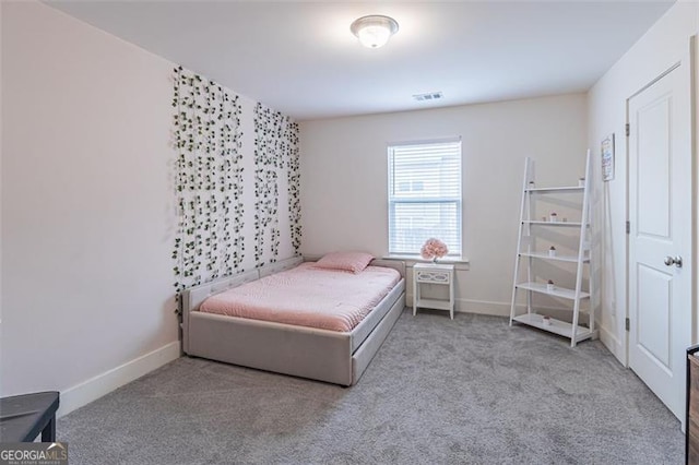 bedroom with light colored carpet