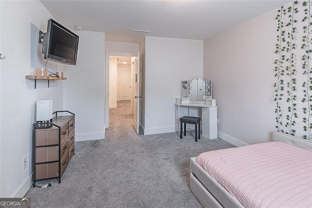 bedroom featuring light carpet