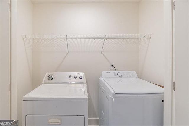 laundry area with washing machine and dryer