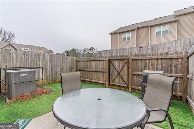 view of patio with cooling unit