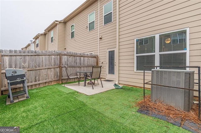 view of yard with a patio and central AC unit