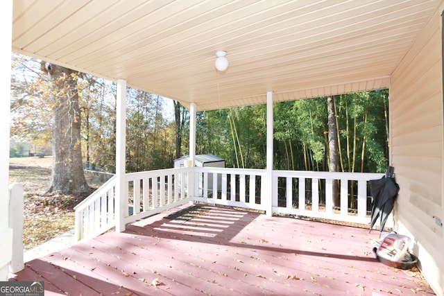 deck featuring a shed