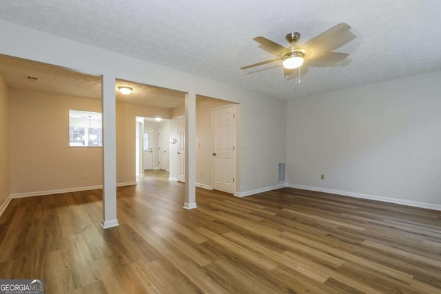 interior space featuring hardwood / wood-style floors, a textured ceiling, and ceiling fan