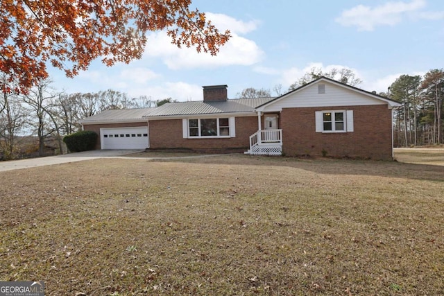 ranch-style house with a garage and a front lawn