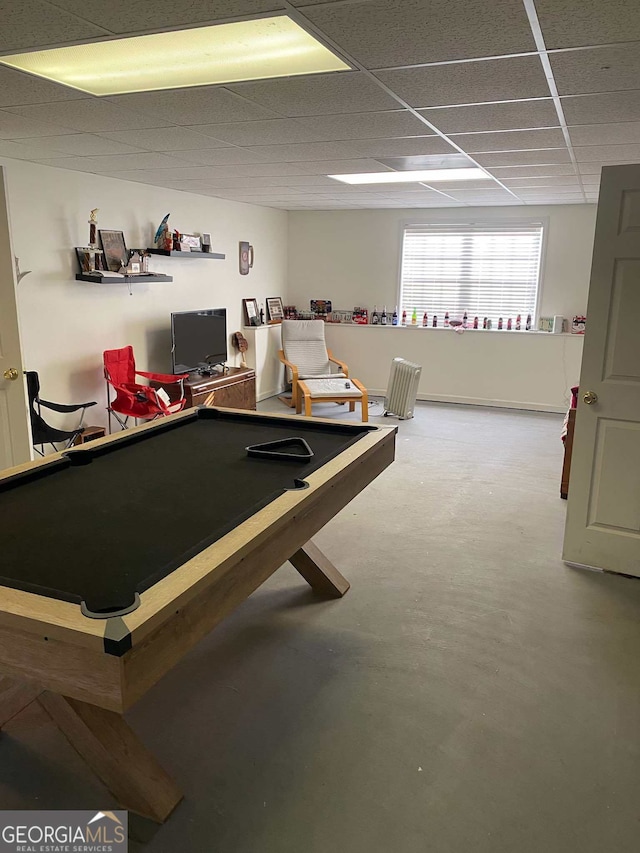 rec room featuring concrete flooring, a paneled ceiling, and pool table