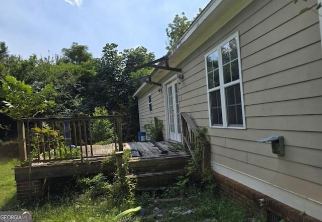 view of side of home featuring a deck