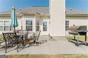 back of property featuring a patio area