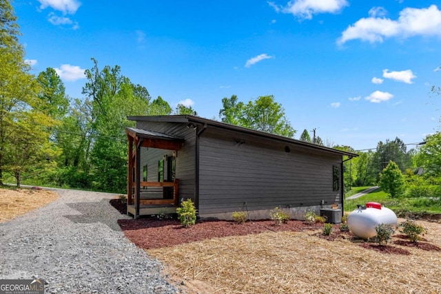 view of side of property with cooling unit