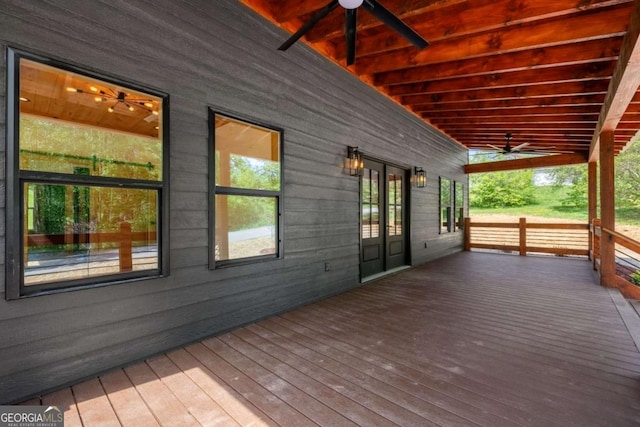 deck featuring covered porch, french doors, and ceiling fan