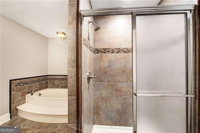 bathroom with a textured ceiling and plus walk in shower