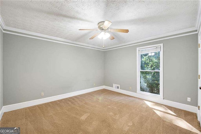 carpeted empty room with a textured ceiling, crown molding, and ceiling fan