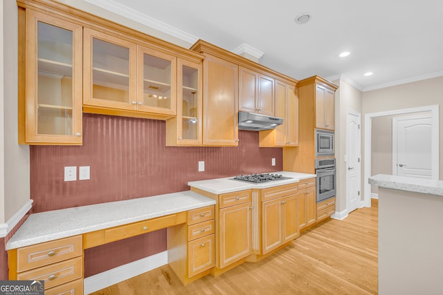 kitchen featuring light hardwood / wood-style floors, built in desk, ornamental molding, and appliances with stainless steel finishes