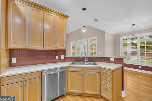 kitchen featuring sink, stainless steel dishwasher, kitchen peninsula, decorative light fixtures, and light wood-type flooring