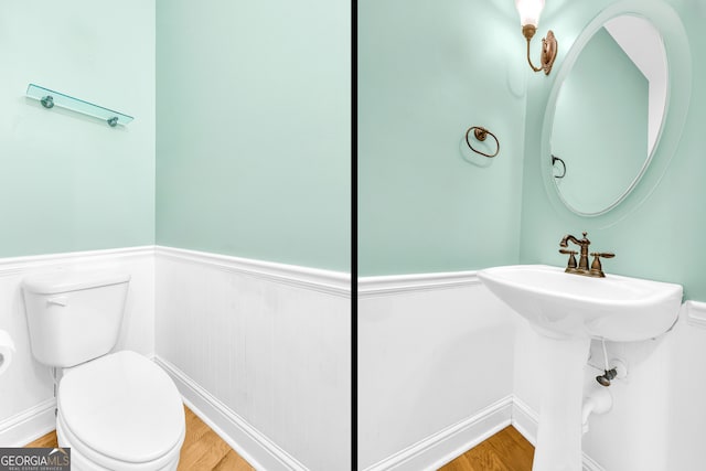 bathroom featuring hardwood / wood-style floors and toilet