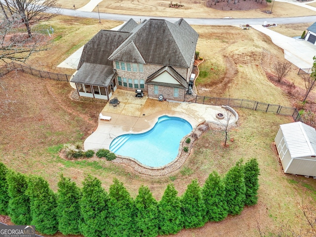 view of swimming pool with an outdoor structure