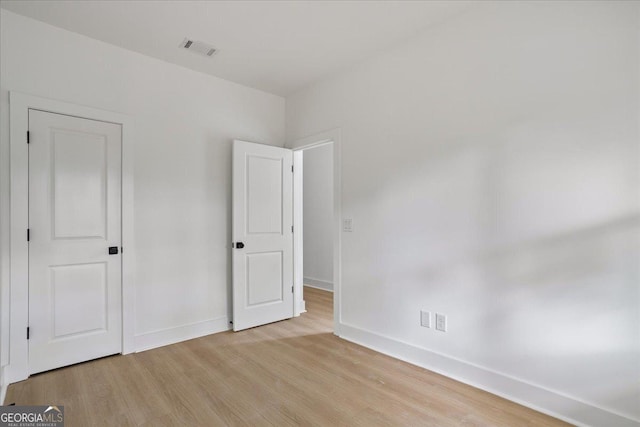 unfurnished bedroom featuring light hardwood / wood-style floors