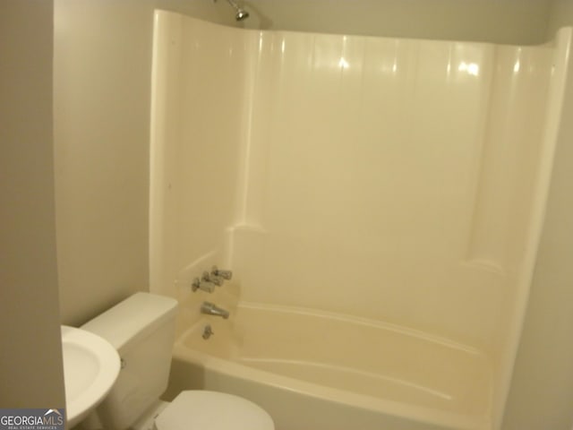 bathroom with toilet and shower / bathtub combination