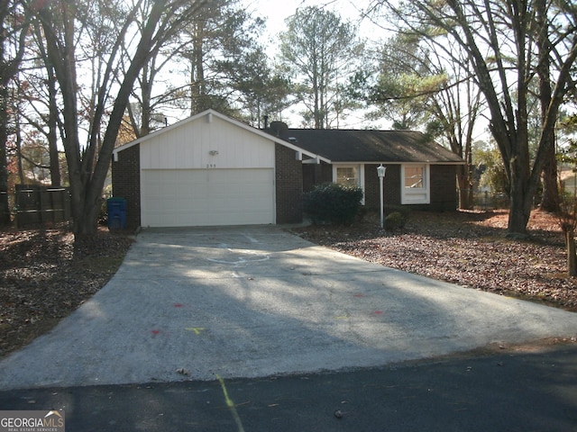 ranch-style house featuring a garage