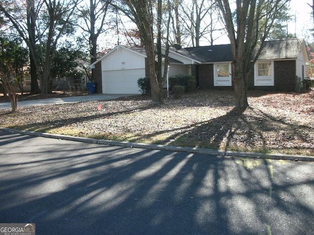 single story home featuring a garage