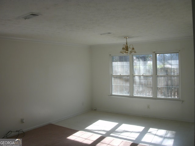 empty room with ornamental molding and a notable chandelier