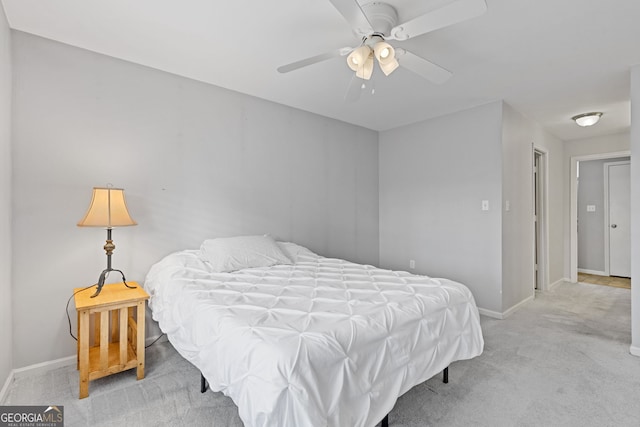 bedroom with light colored carpet and ceiling fan