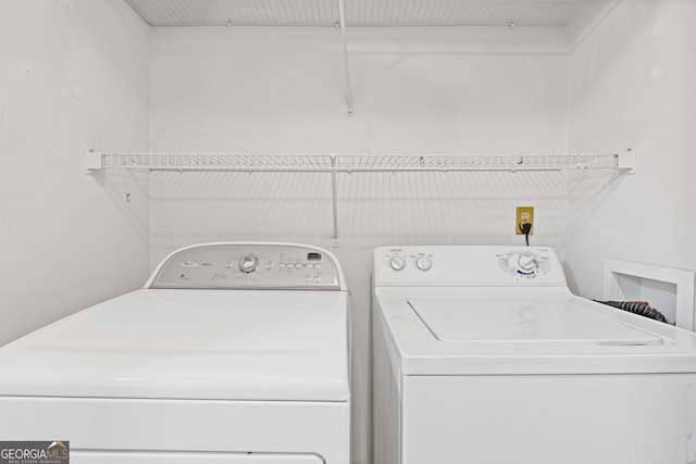 laundry room featuring washing machine and clothes dryer