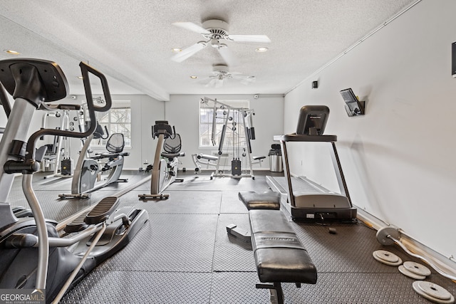 workout room with a textured ceiling and ceiling fan