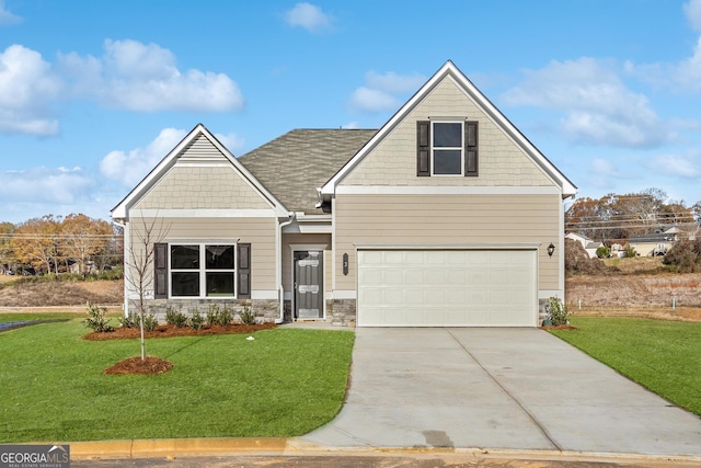 craftsman-style house featuring a garage and a front lawn