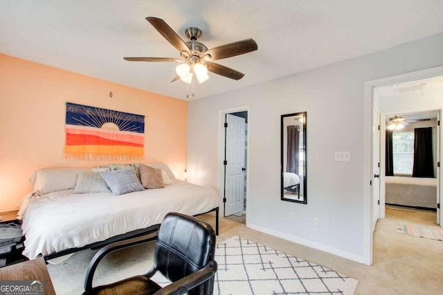 bedroom with ceiling fan and light carpet