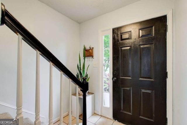 entrance foyer with light tile patterned floors