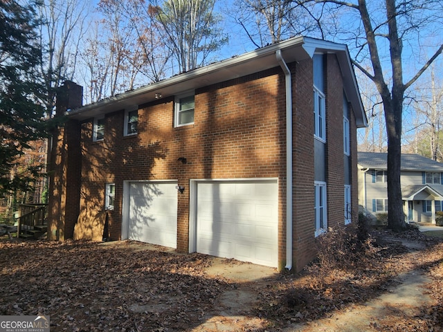 view of side of property featuring a garage