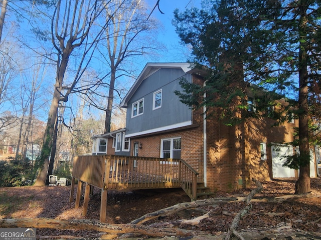 back of property with a wooden deck