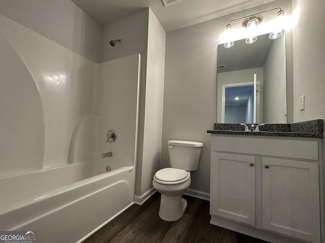 full bathroom with wood-type flooring, vanity, toilet, and shower / tub combination