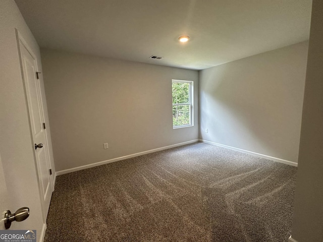 unfurnished room featuring carpet flooring