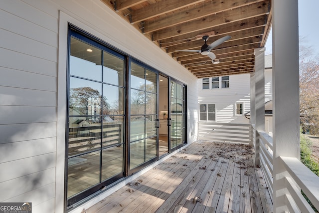 wooden deck with ceiling fan